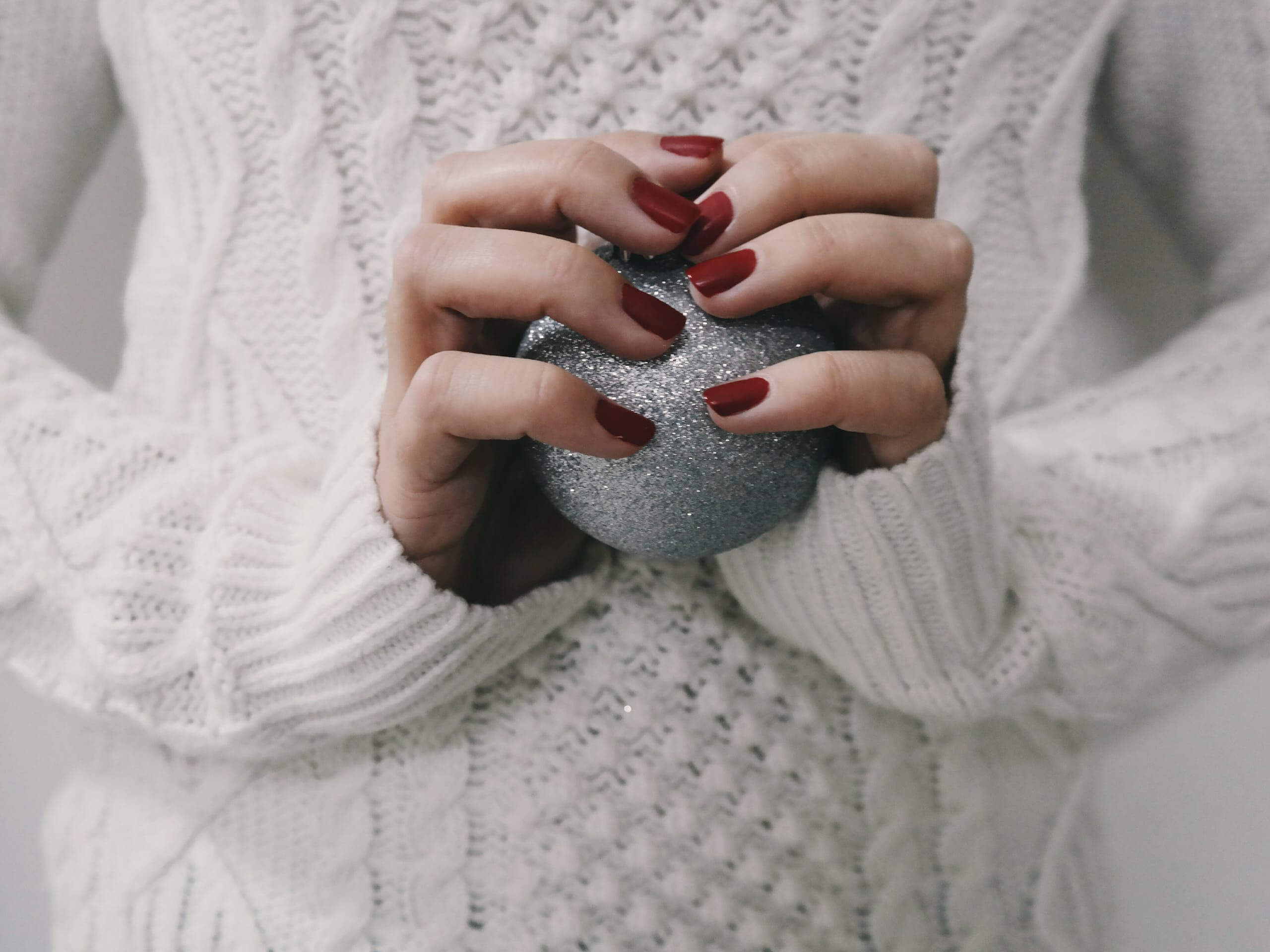 Person Holding Gray Ball