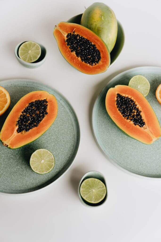 Photo Of Sliced Papaya Beside Sliced Lime